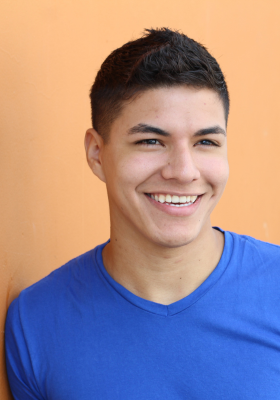 Young Hispanic man smiling portraying results of orthodontic surgery and braces