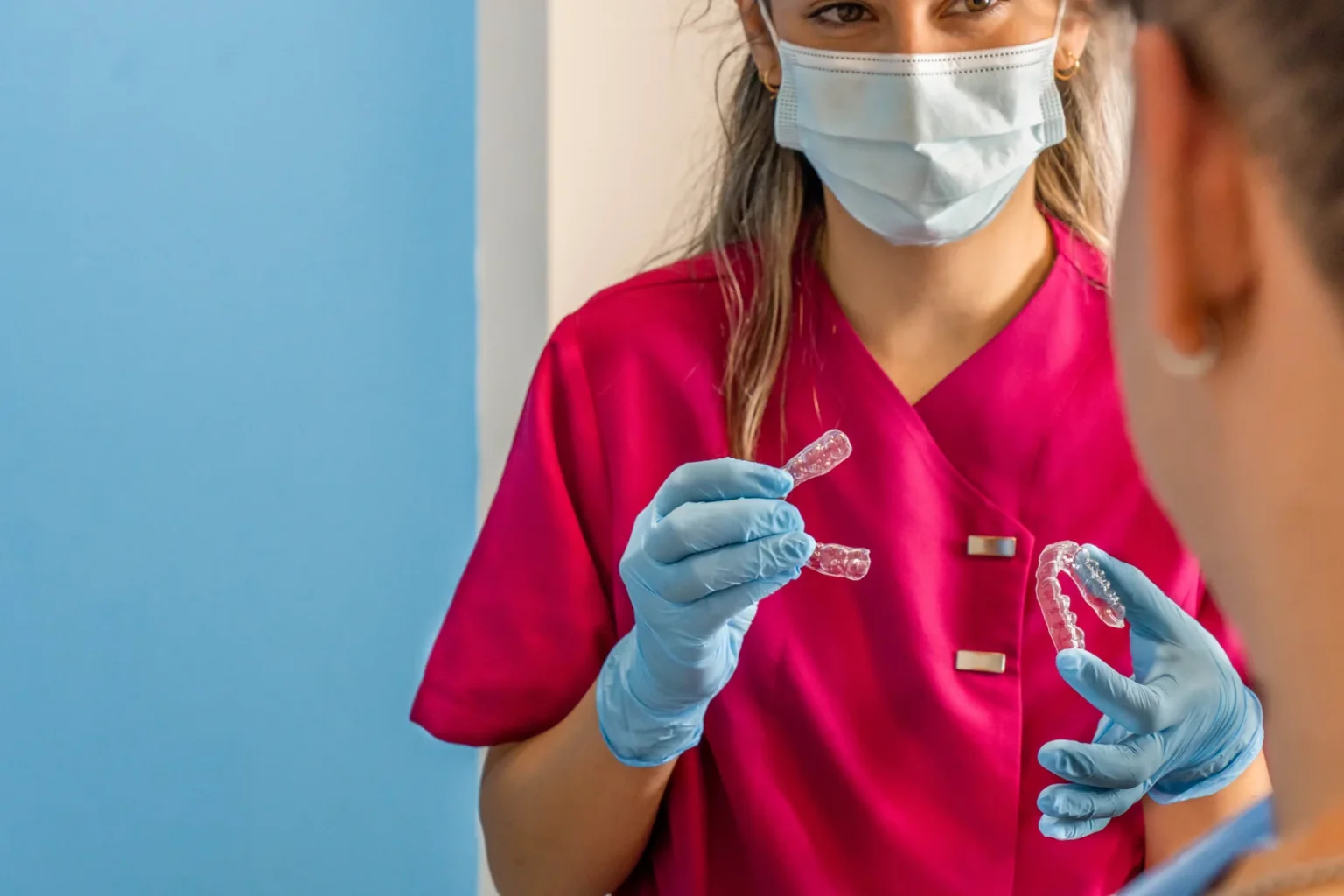 Orthodontic team member explaining clear aligners