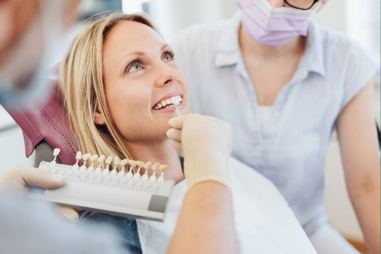 Adult woman smiling at a dental visit