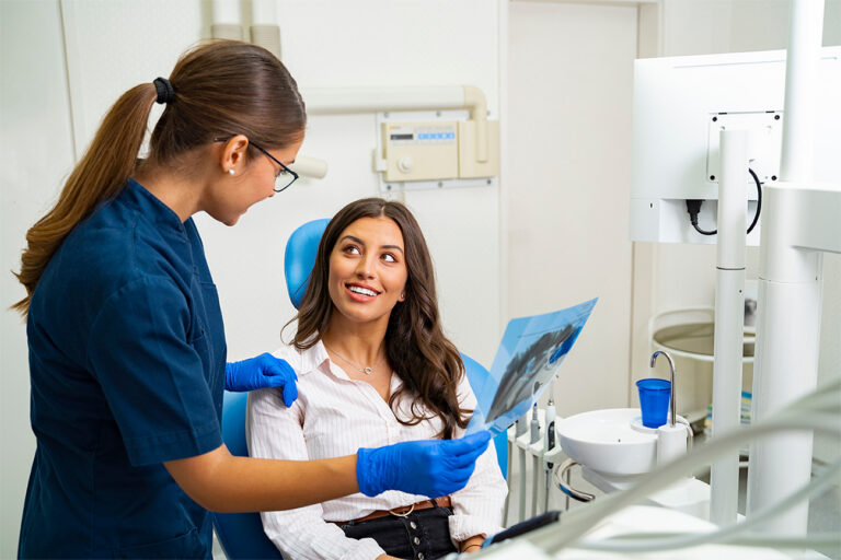 Woman discussing treatment with a dental professional